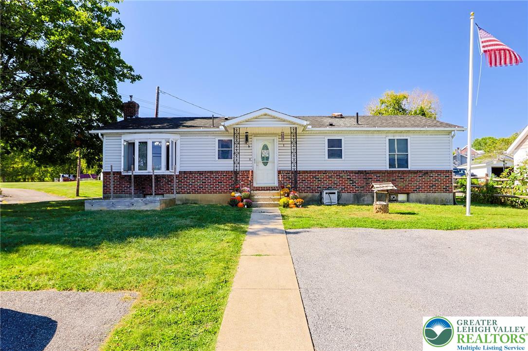 4354 2nd Street Walnutport, PA 18088 - Photo 1 of 21 a front view of a house with a yard and a large tree