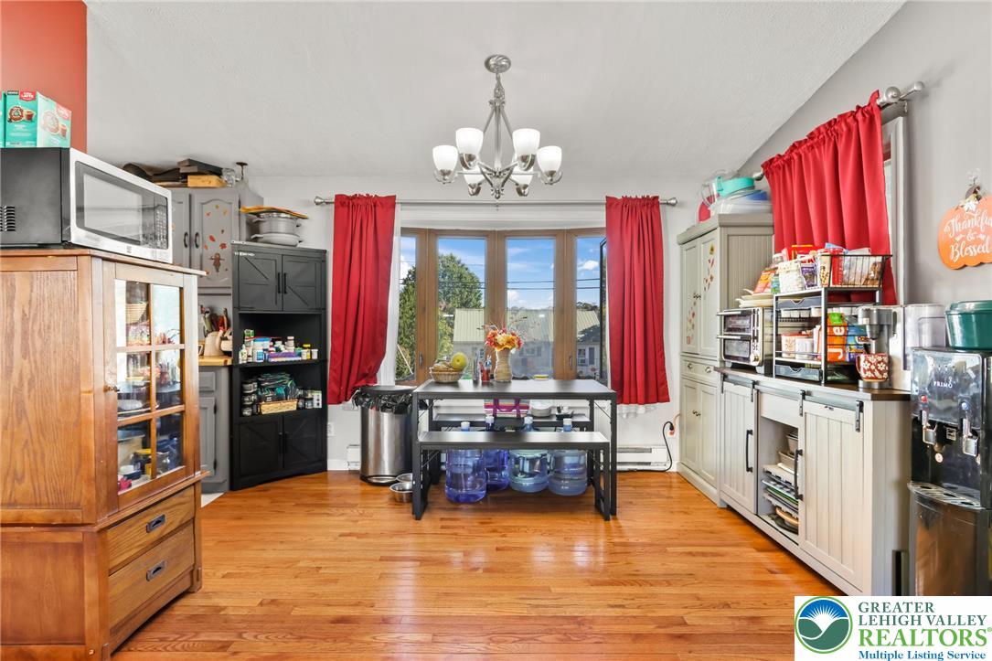 4354 2nd Street Walnutport, PA 18088 - Photo 8 of 21 a kitchen with stainless steel appliances kitchen island granite countertop a refrigerator and a stove top oven