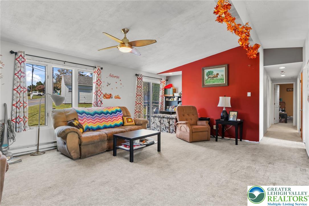 4354 2nd Street Walnutport, PA 18088 - Photo 9 of 21 a living room with furniture and a chandelier