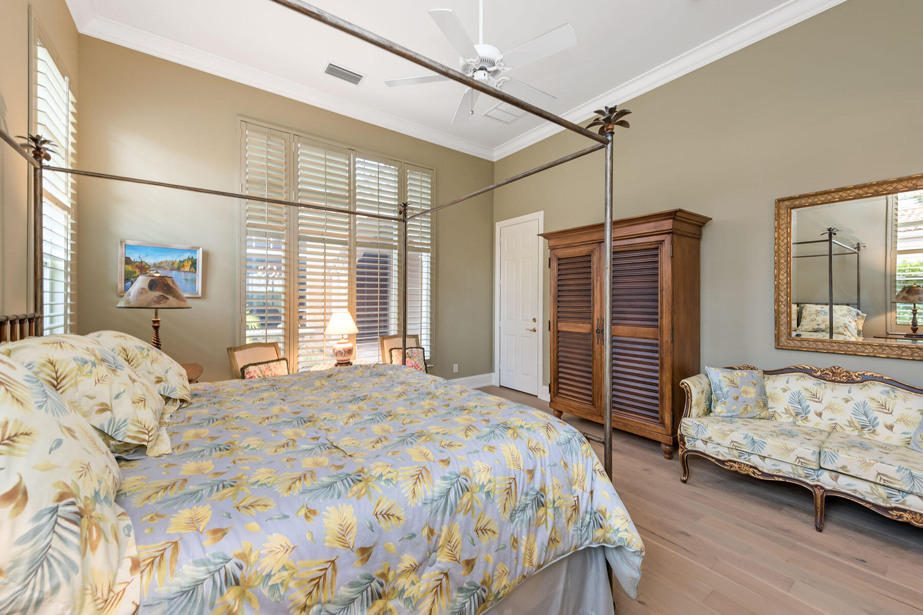 8528 Bellagio Drive Naples, FL 34114 - Photo 15 of 50 a bedroom with a bed and a dresser