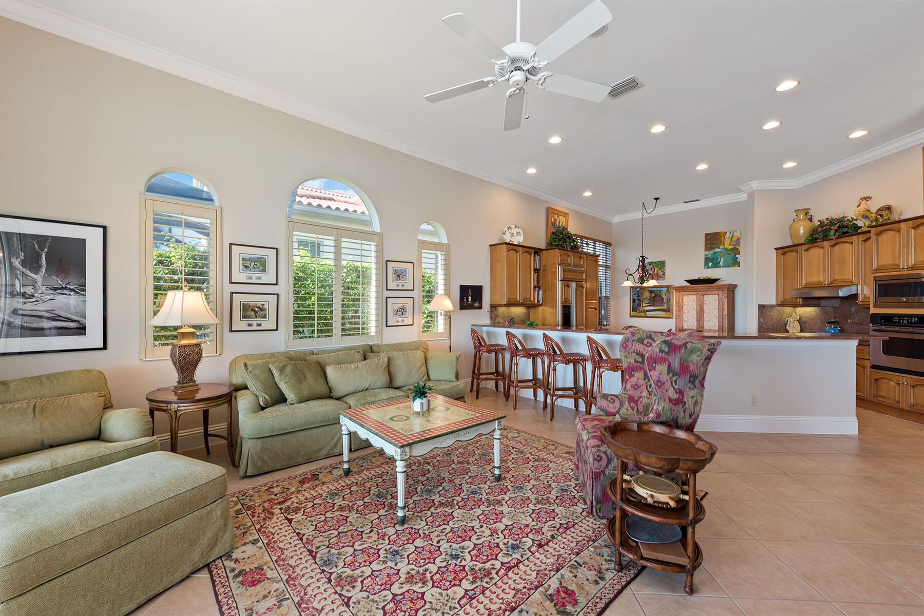8528 Bellagio Drive Naples, FL 34114 - Photo 18 of 50 a living room with furniture and a large window