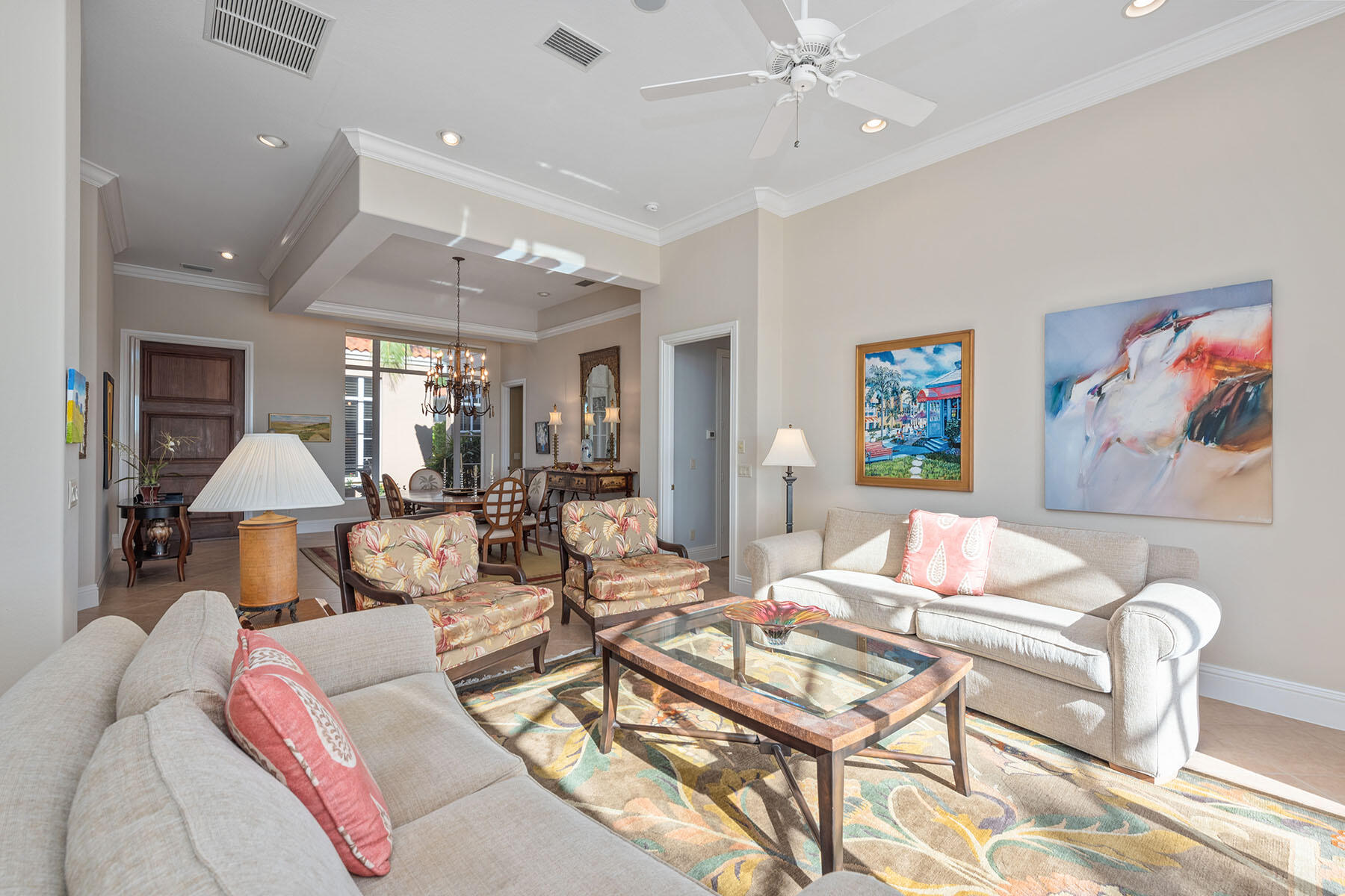 8528 Bellagio Drive Naples, FL 34114 - Photo 2 of 50 a living room with furniture a chandelier and a dining table