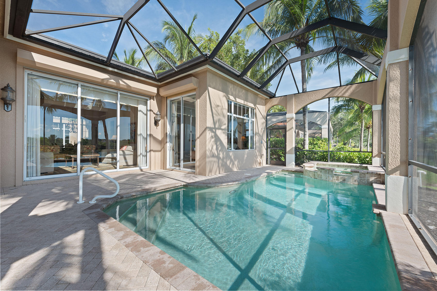 8528 Bellagio Drive Naples, FL 34114 - Photo 23 of 50 a house view with pool space and seating space