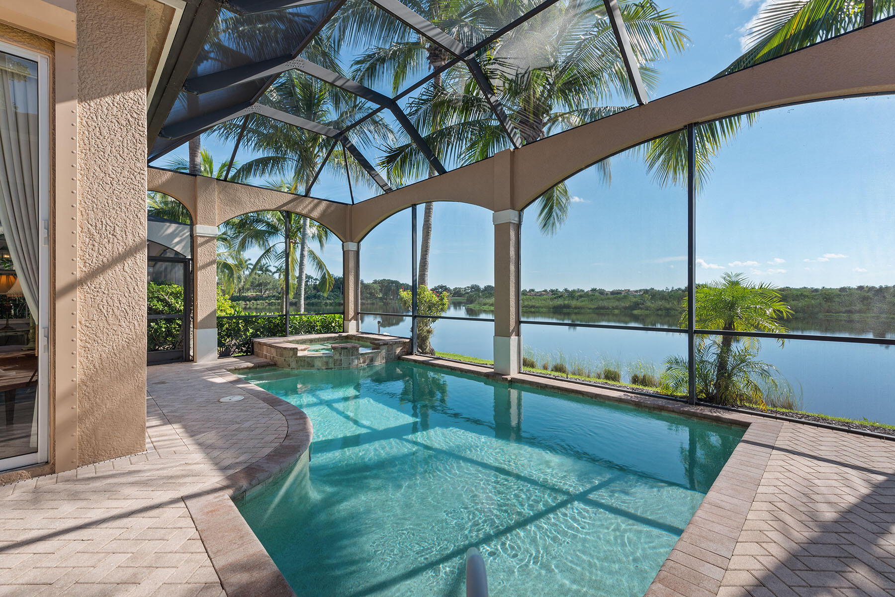 8528 Bellagio Drive Naples, FL 34114 - Photo 25 of 50 a view of a deck with a big yard