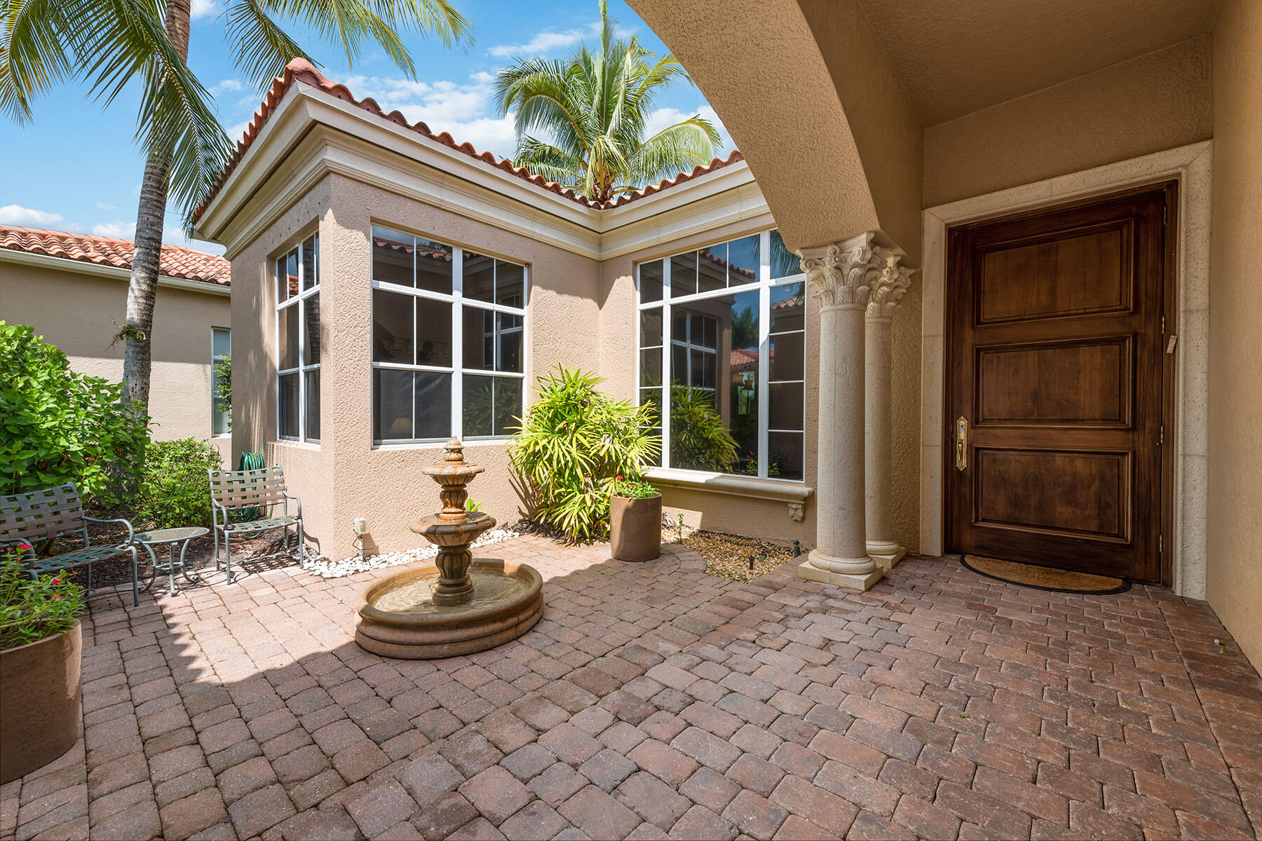 8528 Bellagio Drive Naples, FL 34114 - Photo 27 of 50 a view of a house with backyard and sitting area