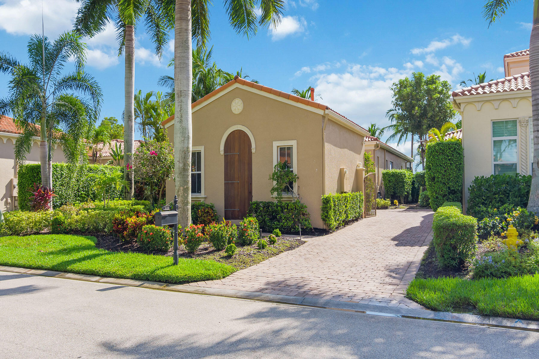 8528 Bellagio Drive Naples, FL 34114 - Photo 31 of 50 a front view of a house with a garden