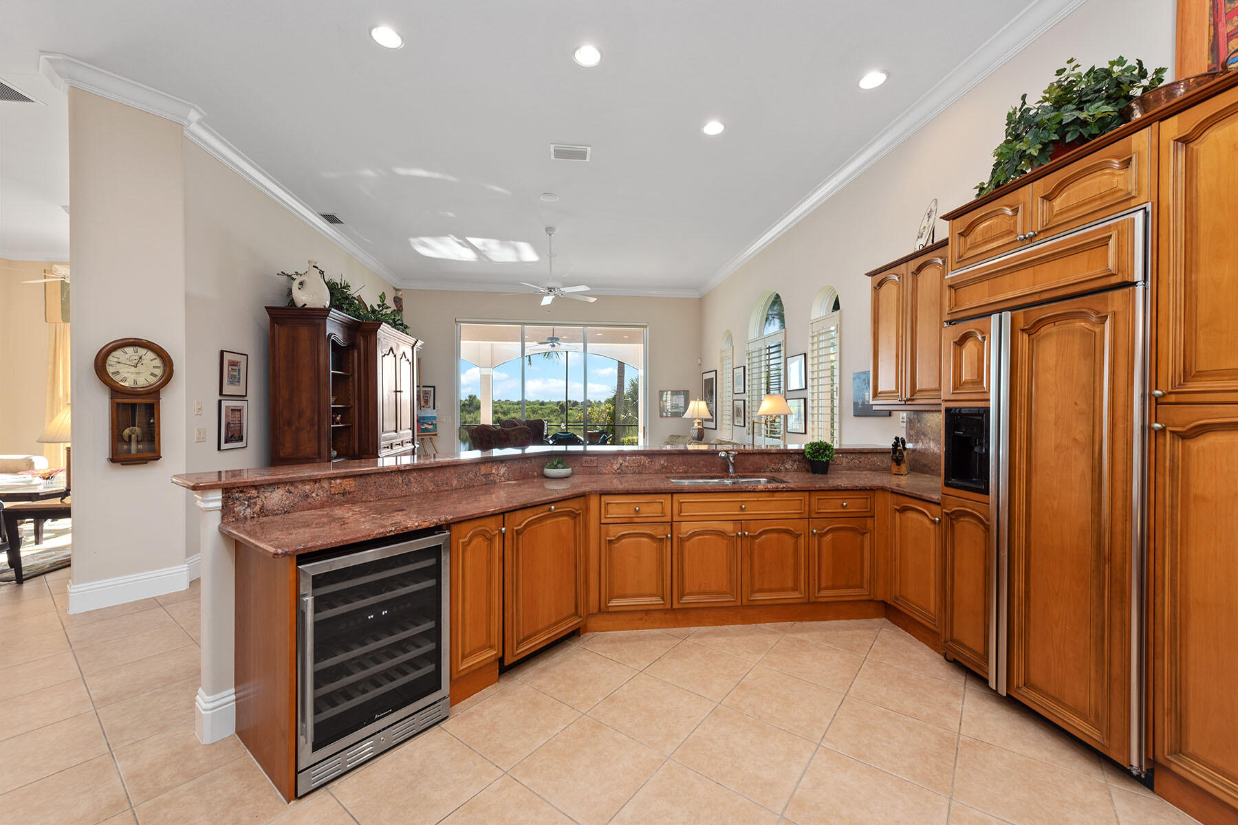 8528 Bellagio Drive Naples, FL 34114 - Photo 6 of 50 a large kitchen with stainless steel appliances granite countertop a stove and a sink