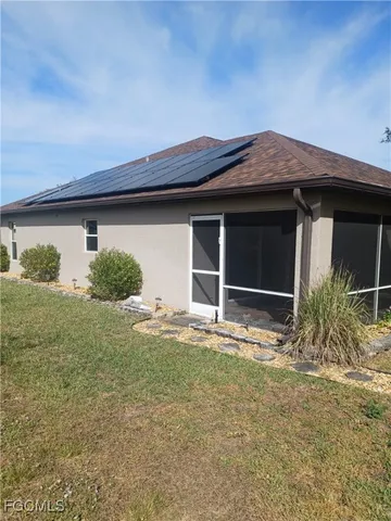 a view of a swimming pool and sitting area in the back
