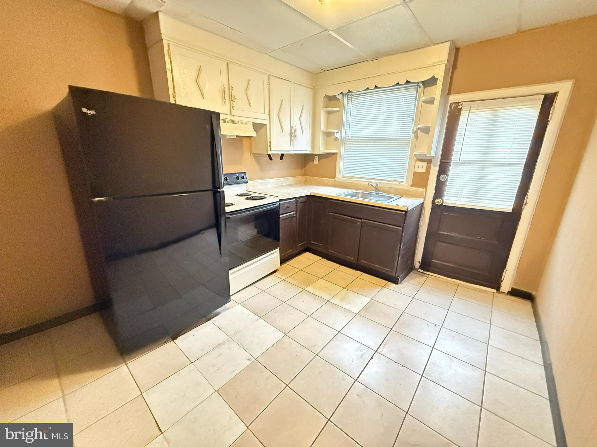 1816 South Chadwick Street Philadelphia, PA 19145 - Photo 4 of 8 a kitchen with stainless steel appliances a refrigerator and a counter