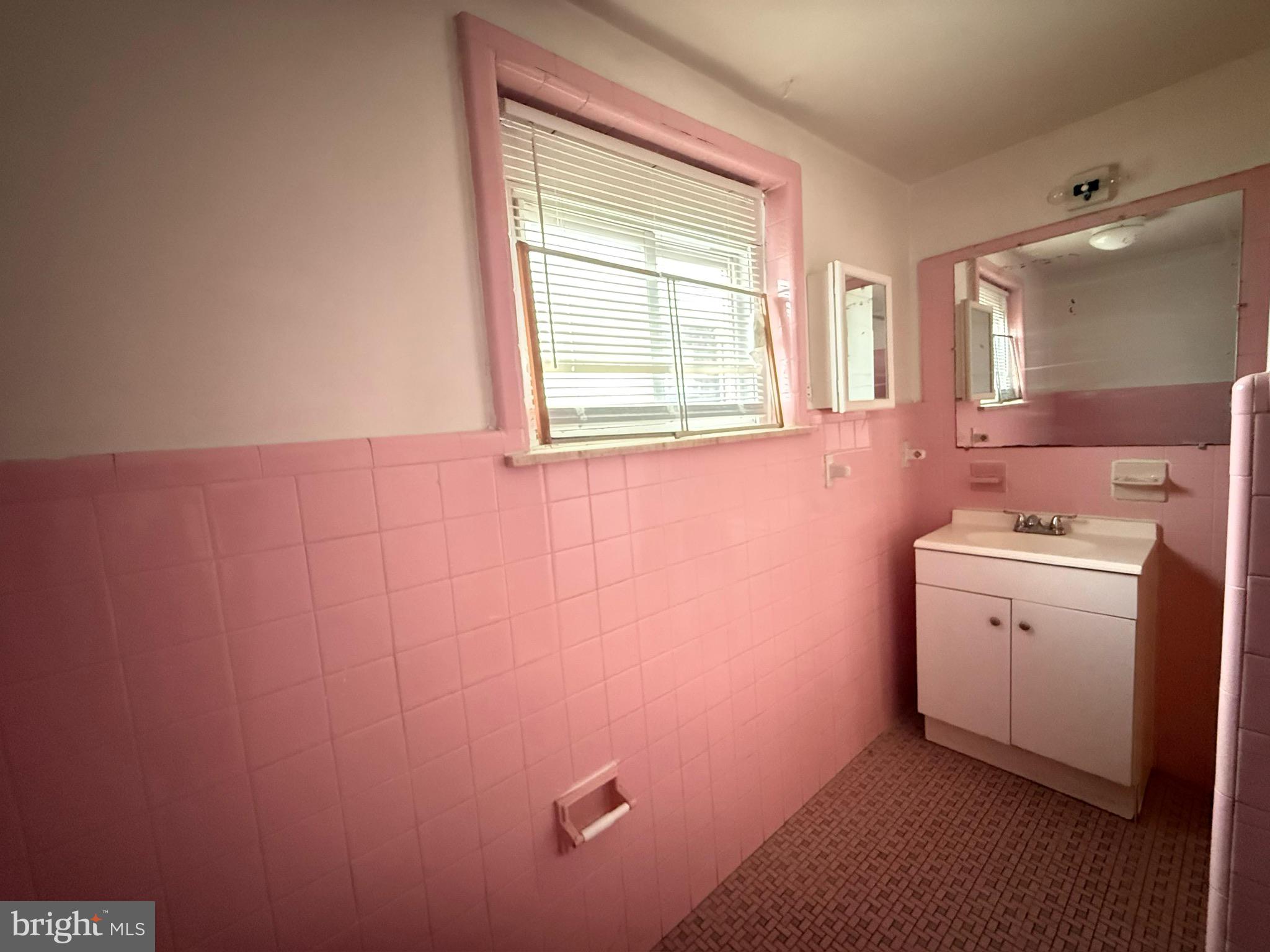 1816 South Chadwick Street Philadelphia, PA 19145 - Photo 7 of 8 a bathroom with a sink and a mirror