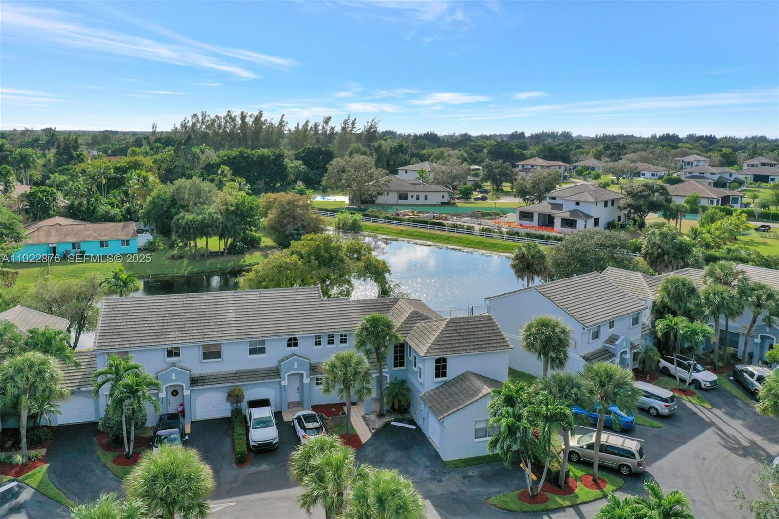 an aerial view of a house with outdoor space and lake view