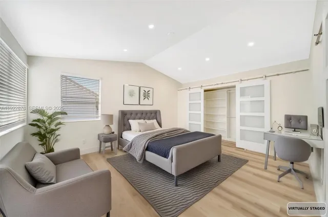 a view of a double vanity sink and a window