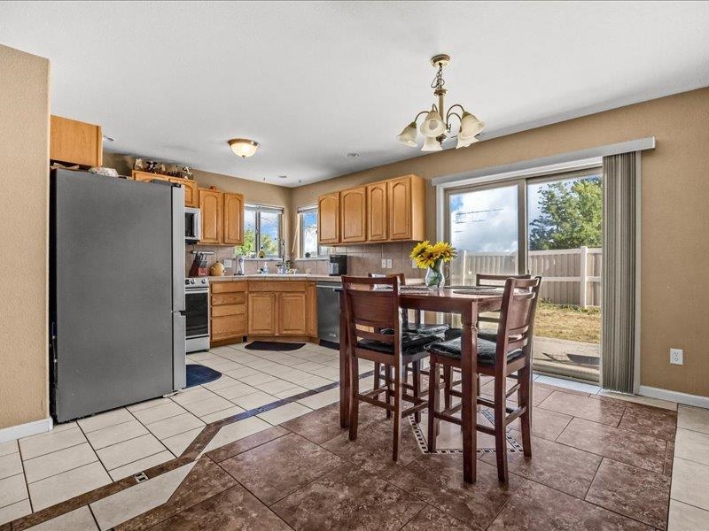 2860 B B 3/4 Road Grand Junction, CO 81503 - Photo 15 of 29 a view of a dining room with furniture window and outside view