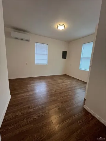 a view of room with wooden floor