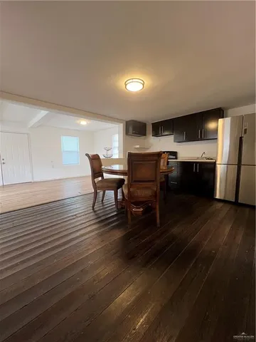 a room with wooden floor and furniture