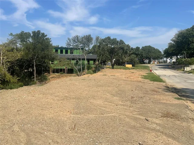 a view of swimming pool with outdoor seating and green space