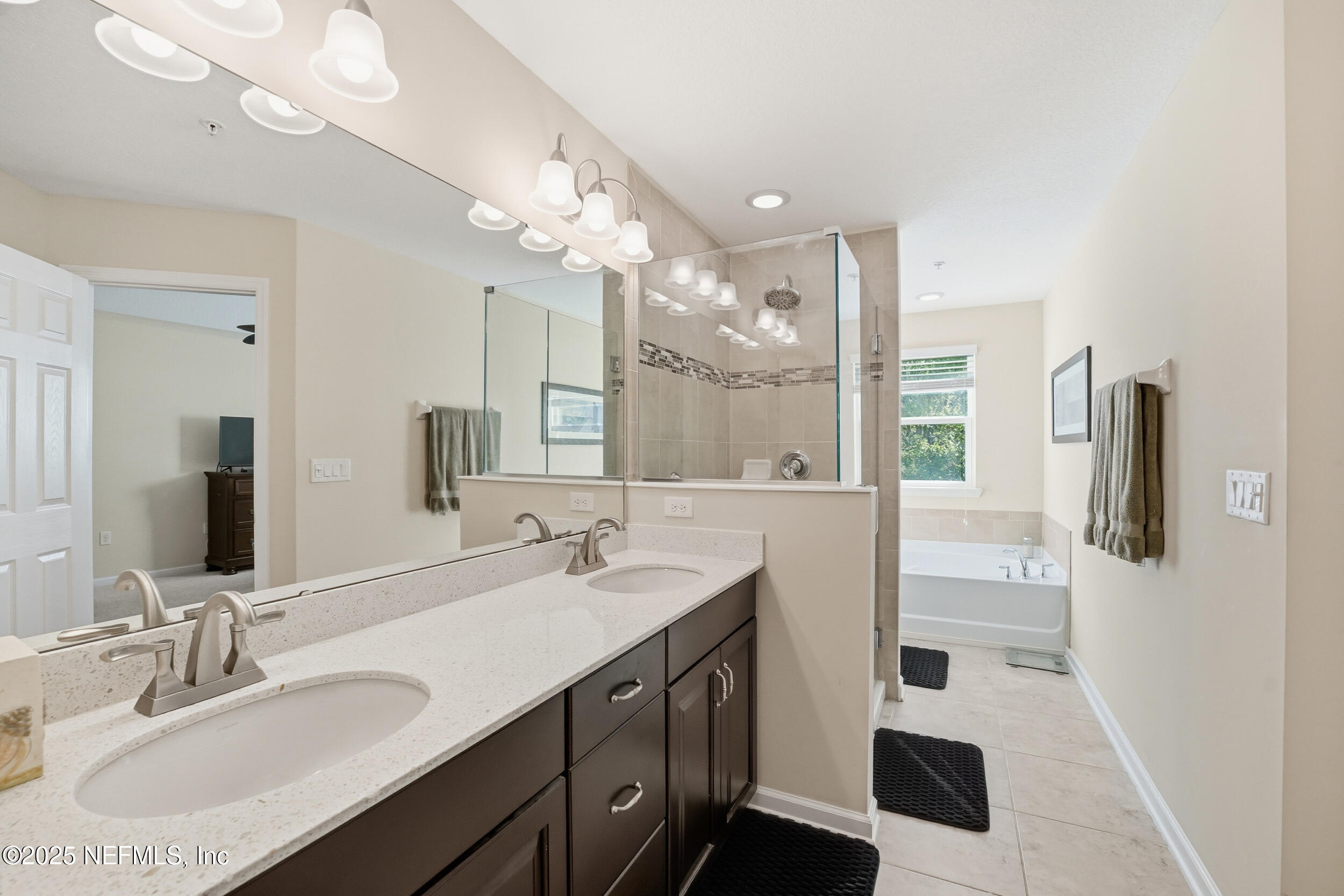 362 Paradas Place St. Augustine, FL 32092 - Photo 13 of 27 a bathroom with a sink double vanity and a mirror