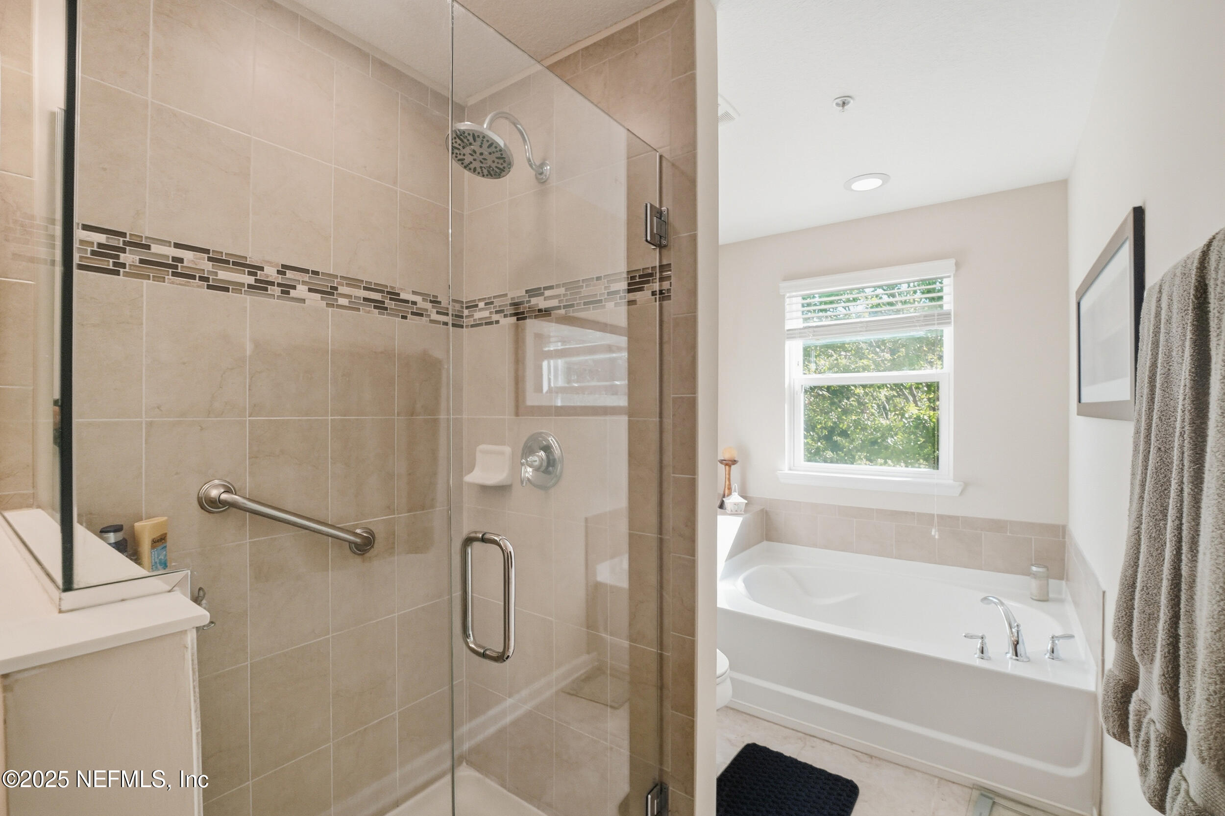 362 Paradas Place St. Augustine, FL 32092 - Photo 14 of 27 a bathroom with a shower and a bath tub