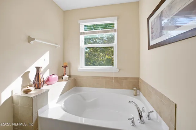 a bathroom with a tub and sink