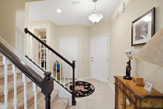 a view of a livingroom with furniture a front door