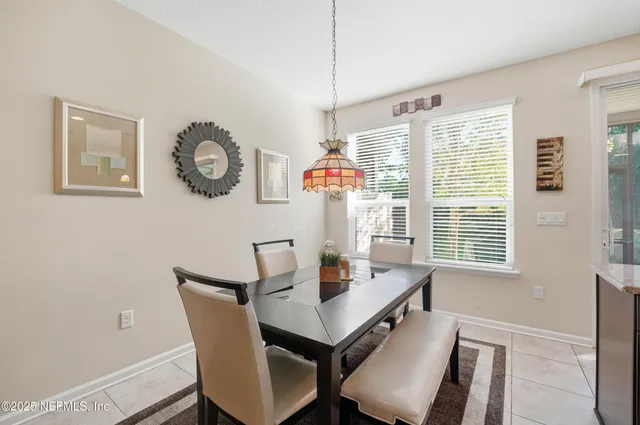 a view of a room with furniture and a large window