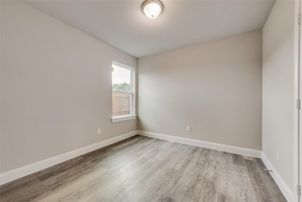 3153 Stag Road Dallas, TX 75241 - Photo 10 of 15 a view of empty room with wooden floor and fan