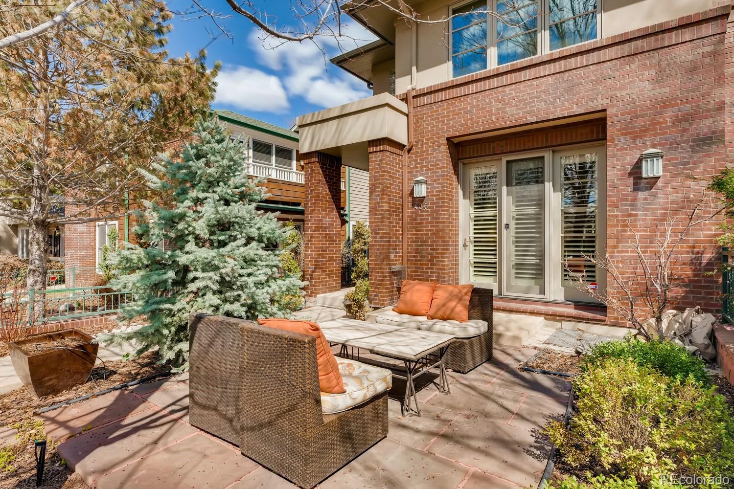 436 Jackson Street Denver, CO 80206 - Photo 1 of 40 a backyard of a house with outdoor seating