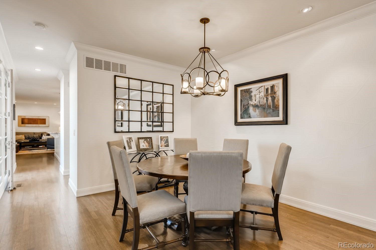 436 Jackson Street Denver, CO 80206 - Photo 12 of 40 a view of a dining room with furniture wooden floor and chandelier