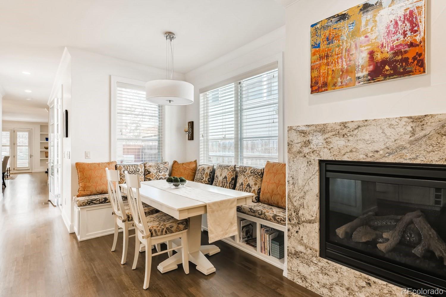 436 Jackson Street Denver, CO 80206 - Photo 16 of 40 a view of a dining room with furniture window and wooden floor