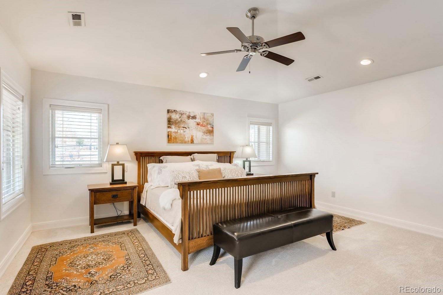 436 Jackson Street Denver, CO 80206 - Photo 19 of 40 a bed room with a bed and a window