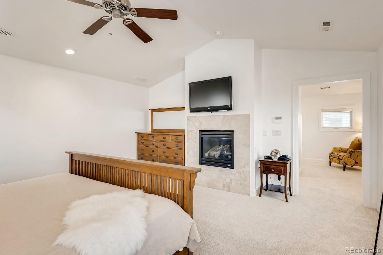 436 Jackson Street Denver, CO 80206 - Photo 22 of 40 a bed room with a bed and a television