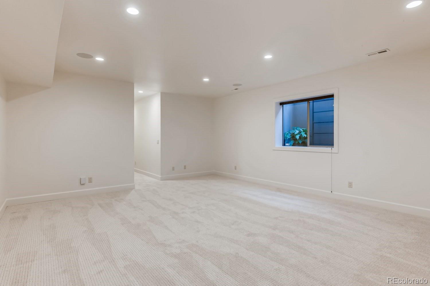 436 Jackson Street Denver, CO 80206 - Photo 31 of 40 an empty room with windows