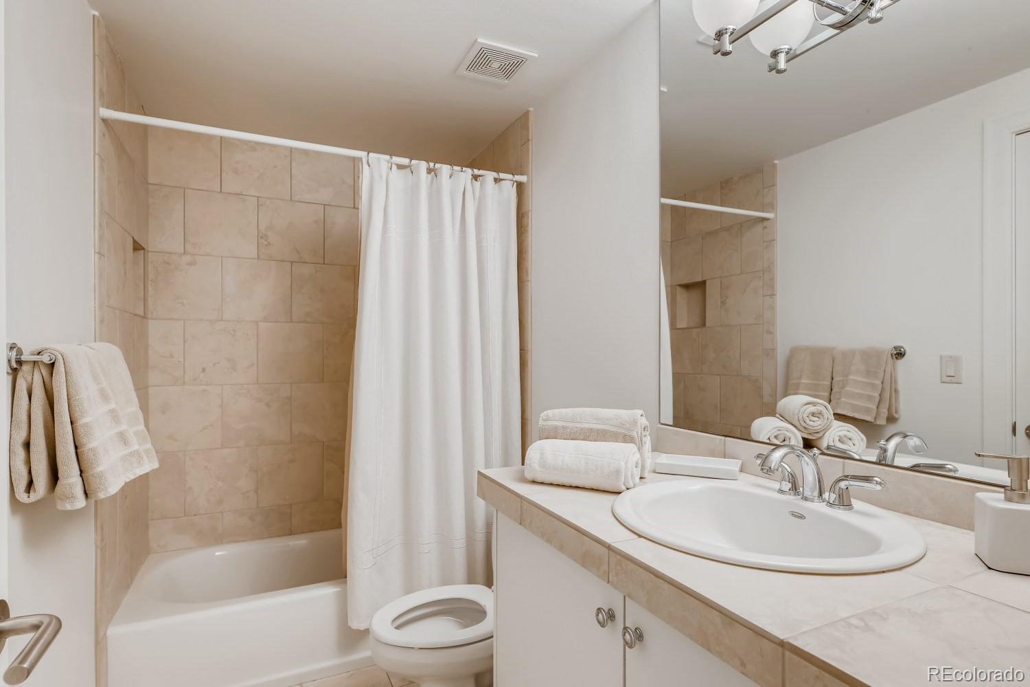 436 Jackson Street Denver, CO 80206 - Photo 34 of 40 a bathroom with a sink toilet and shower