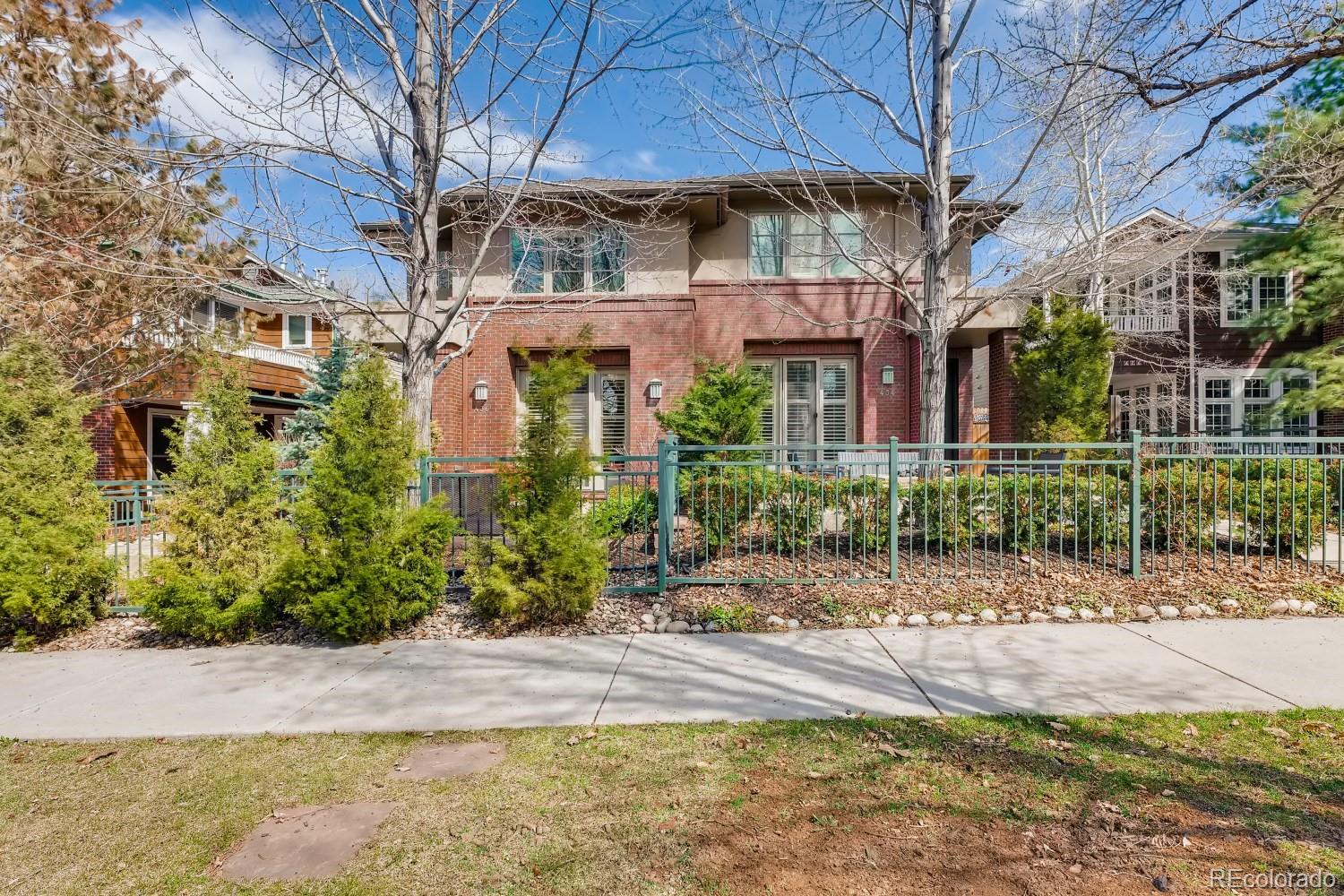 436 Jackson Street Denver, CO 80206 - Photo 4 of 40 a front view of a house with a yard