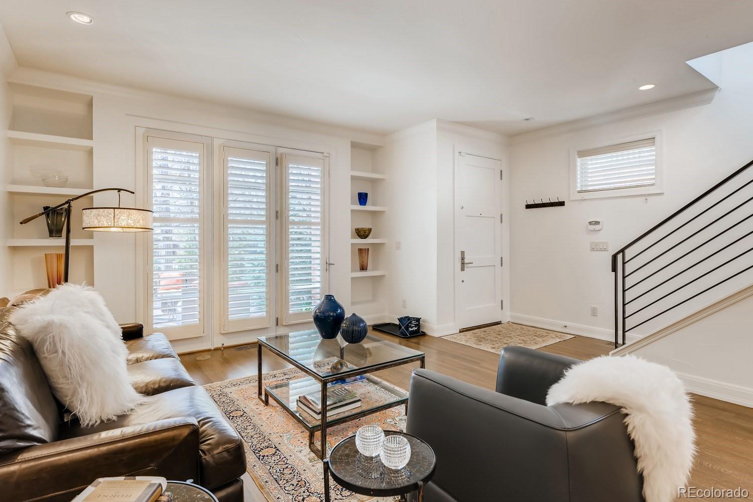 436 Jackson Street Denver, CO 80206 - Photo 5 of 40 a living room with furniture and a large window
