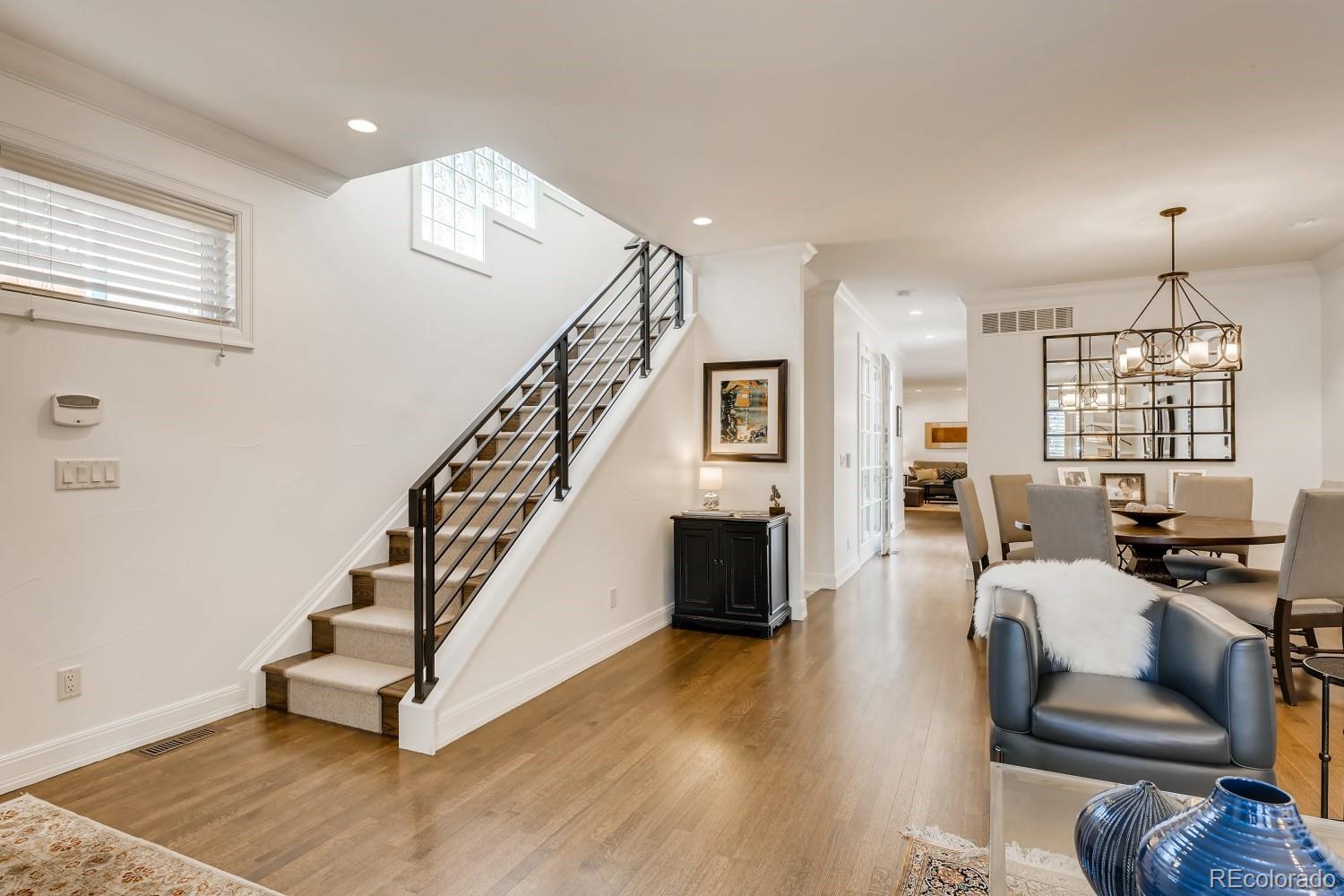 436 Jackson Street Denver, CO 80206 - Photo 7 of 40 a living room with furniture and wooden floor