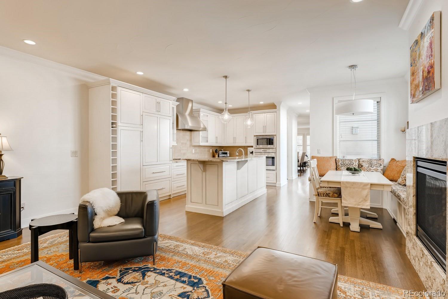 436 Jackson Street Denver, CO 80206 - Photo 10 of 40 a living room with furniture and kitchen view