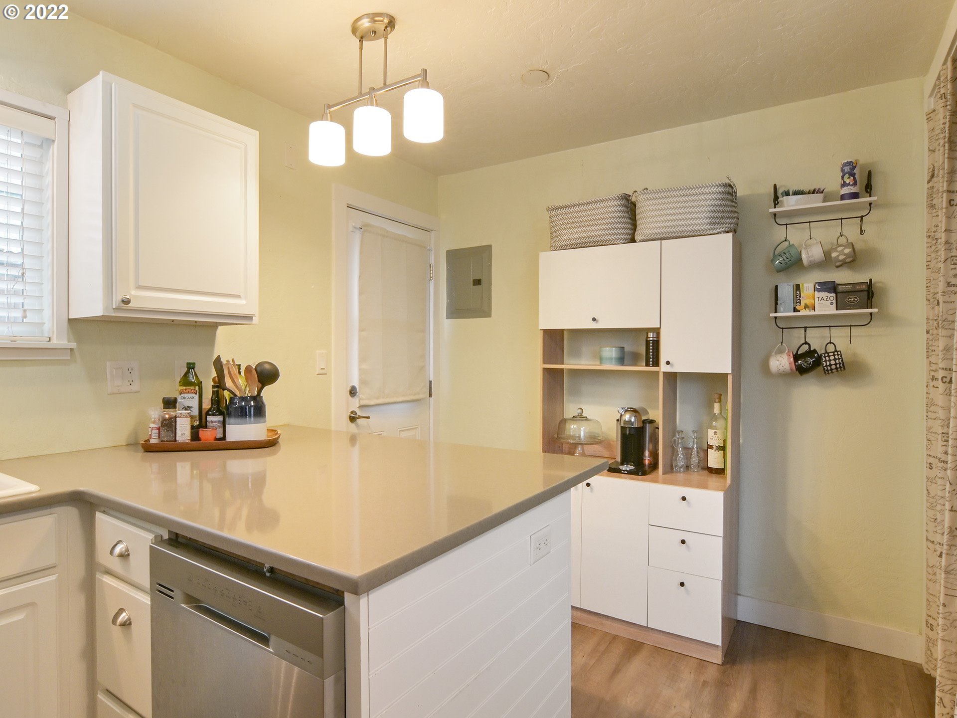 1704 H Street Springfield, OR 97477 - Photo 11 of 30 a kitchen with a sink dishwasher and white cabinets