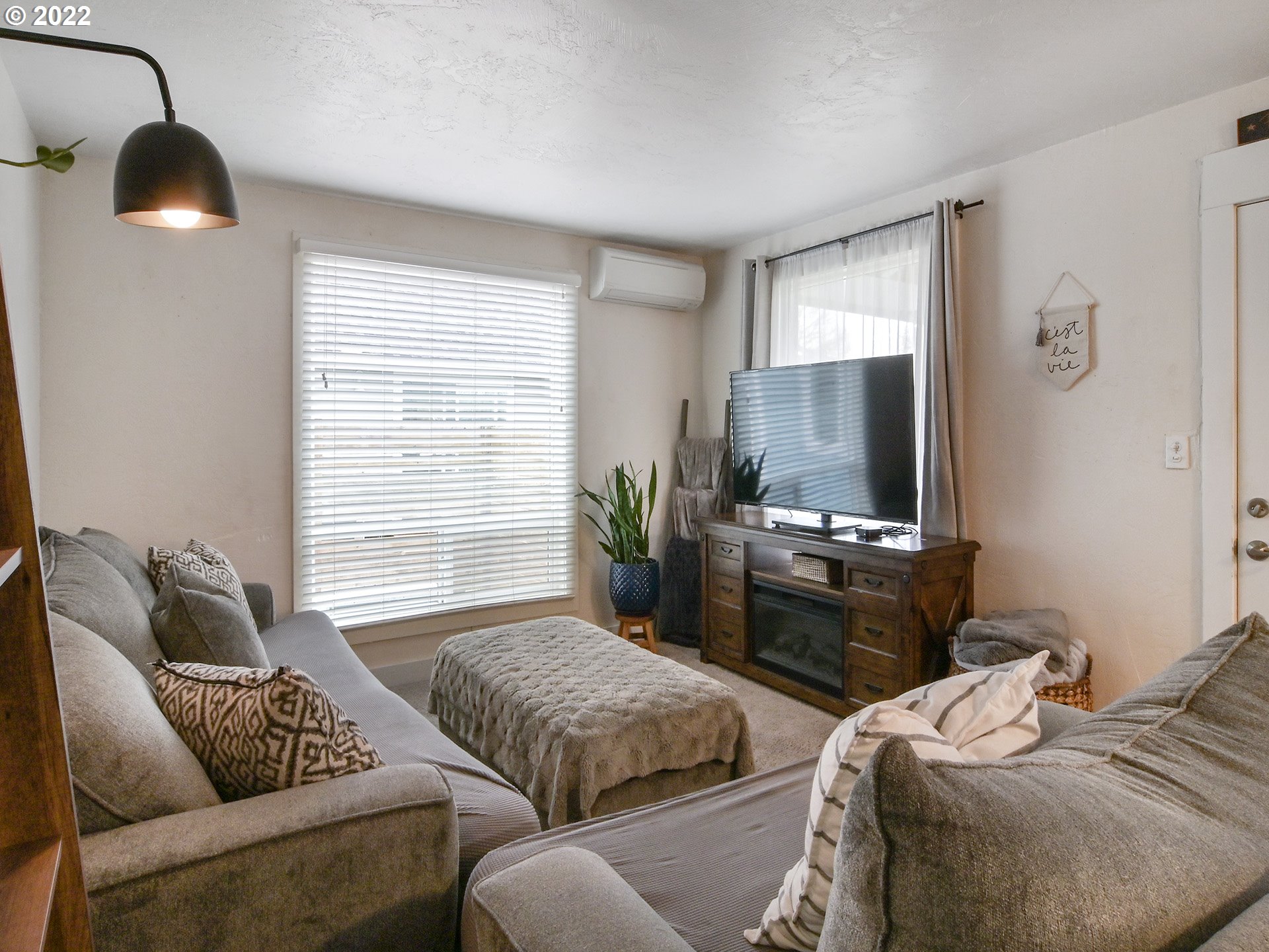 1704 H Street Springfield, OR 97477 - Photo 13 of 30 a bedroom with a bed and wooden floor