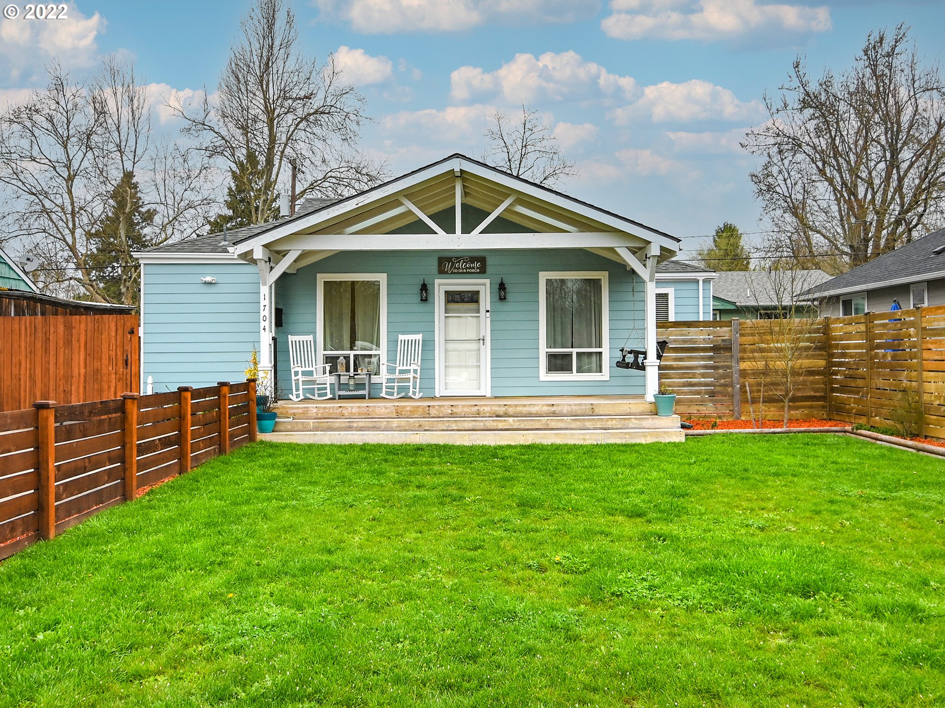 1704 H Street Springfield, OR 97477 - Photo 3 of 30 a front view of a house with a yard