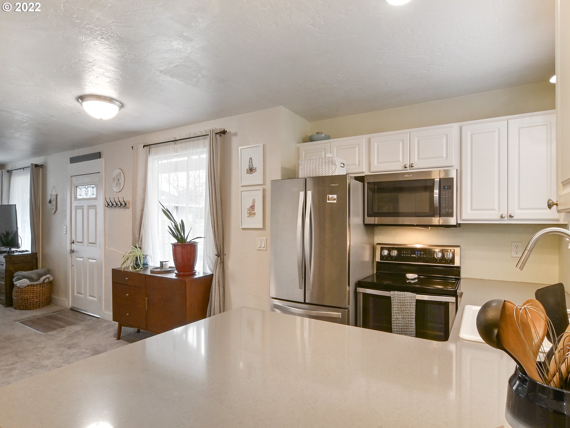 1704 H Street Springfield, OR 97477 - Photo 8 of 30 a kitchen with stainless steel appliances granite countertop a refrigerator stove and sink