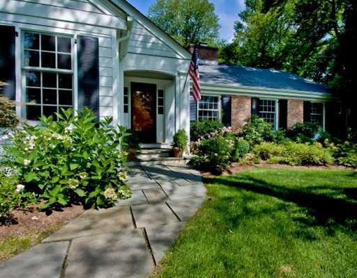 7 Rabbit Lane Darien, CT 06820 - Photo 3 of 20 a front view of a house with a garden