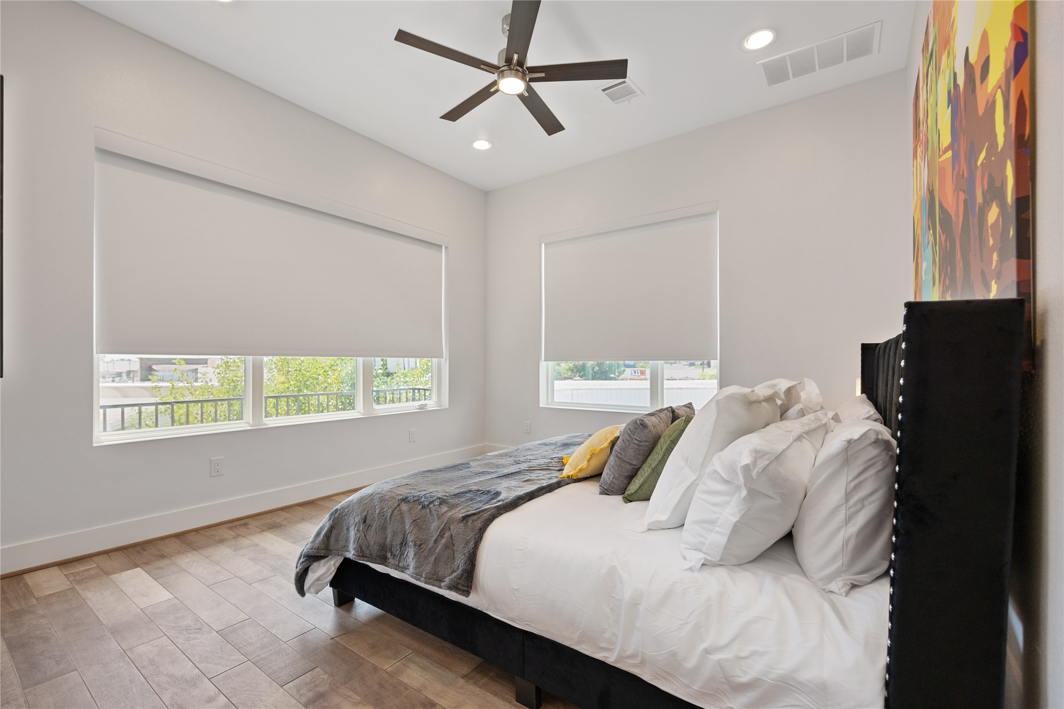 5914 Val Verde Street Houston, TX 77057 - Photo 11 of 25 a bedroom with a bed and wooden floor