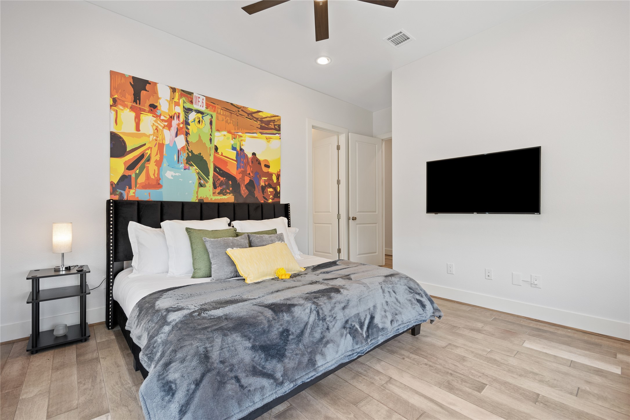 5914 Val Verde Street Houston, TX 77057 - Photo 12 of 25 a bedroom with a bed and a flat screen tv