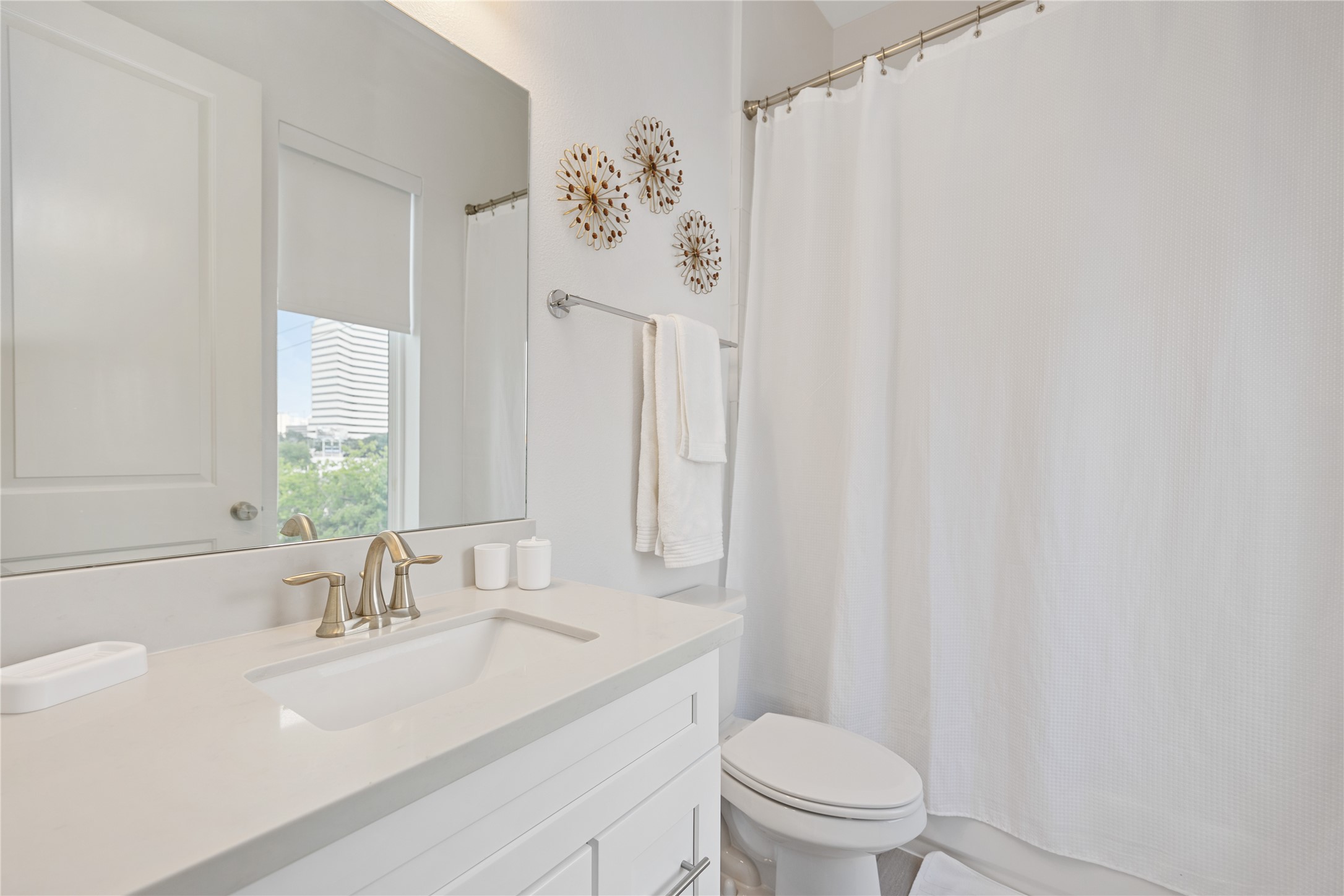 5914 Val Verde Street Houston, TX 77057 - Photo 19 of 25 a bathroom with a sink a toilet and a mirror