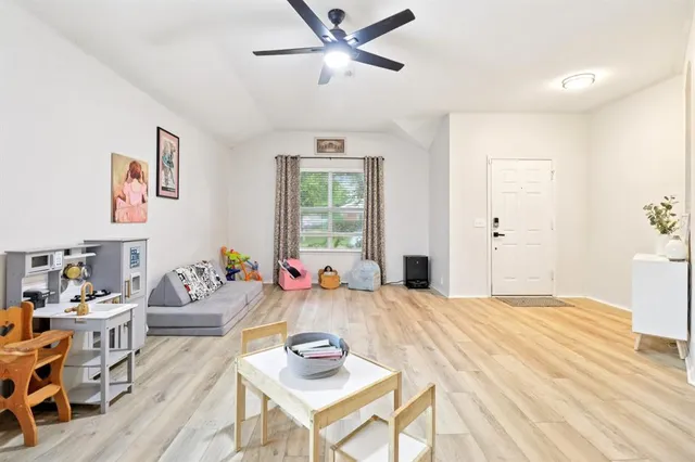 a bedroom with furniture and a window