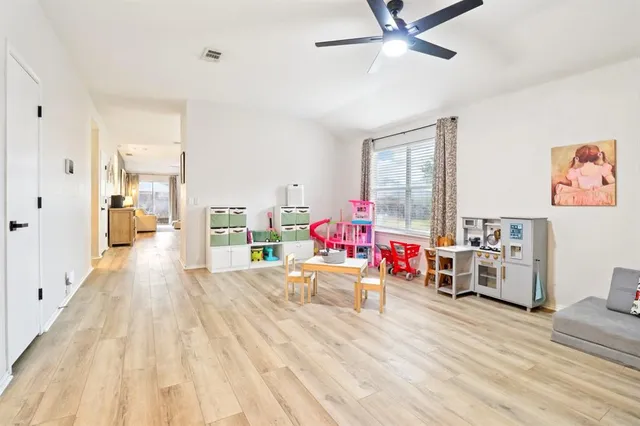 a bedroom with furniture and a window