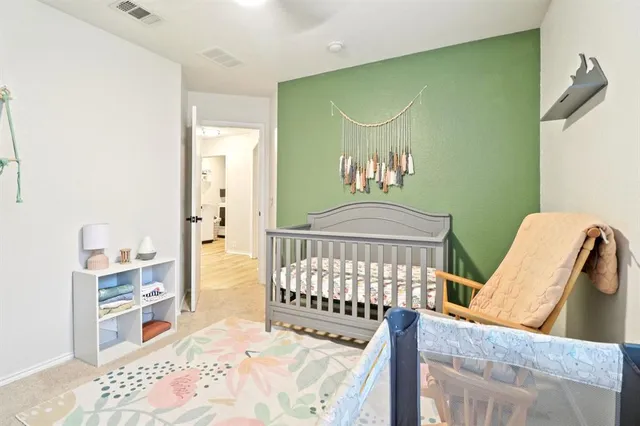 a bedroom with furniture and a window