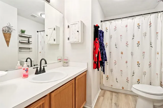 a bedroom with furniture and a window