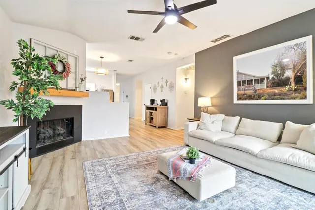 a living room with furniture and a fireplace
